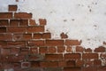 WHite paint on brick. White paint and plaster eroded from a brick wall in an abandonded building. Royalty Free Stock Photo