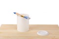 white paint with a brush on a wooden background with texture Royalty Free Stock Photo