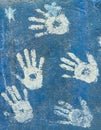 White paint handprints on a sky blue wall Royalty Free Stock Photo