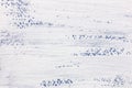 White paint layer on blue textured paper surface Royalty Free Stock Photo