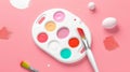 Colorful artist paint palette on a pink background. Various bright colors are arranged in a white tray. Used for Royalty Free Stock Photo