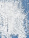 White paint splashing on blue wall creating textured background Royalty Free Stock Photo