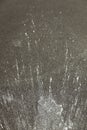 White Paint Splattered On Asphalt Surface