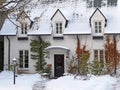 White painted brick house with snow