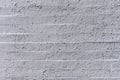 A white painted brick wall with lumps and chips Royalty Free Stock Photo
