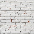 White painted brick wall with visible red-brown patches of worn and chipped paint Royalty Free Stock Photo