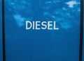 White painted diesel sign on blue background