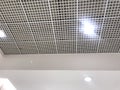 An White painted Emulsion painted for an gypsum ceiling with Macro Grid ceiling for an suspended false ceiling of an Shopping mall