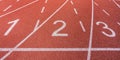 White painted lines and numbers on a running track in a athleticism and sports field. Royalty Free Stock Photo