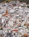 White painted Spanish houses cover the hillside. Competa, Spain.