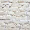 White painted stone wall texture as background. Cracked concrete vintage block stone wall background, old painted wall. Background Royalty Free Stock Photo