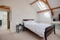 White painted sunlit bedroom