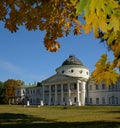 White palace surrounded with autumn trees