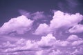 White, pale pink purple clouds on a light blue gray sky. Digital lavender, lilac shades. Royalty Free Stock Photo