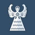 White paper angel with a christmas star on a dark blue background. Beautiful decor angel is form for carving.