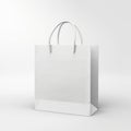 White paper bag with handle for shopping, front view isolated on a white background Royalty Free Stock Photo