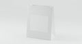 White paper bag with a simple design stands against a plain background. Rectangular Royalty Free Stock Photo