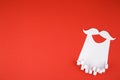 White paper beard on red background