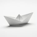 A white paper boat with a dotted pattern is displayed against a plain white background. The boat is folded with precision, Royalty Free Stock Photo