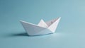 White paper boat on light blue background Royalty Free Stock Photo