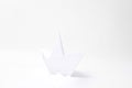 white paper boat sailing on white sea