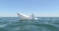 White paper boat is sinking in the sea water Royalty Free Stock Photo