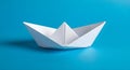 White paper boat on a vibrant blue background Royalty Free Stock Photo