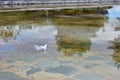 White paper boat on water Royalty Free Stock Photo