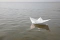 White paper boat on water surface, space for text Royalty Free Stock Photo