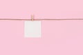 White paper cards on clothes-pegs on pink background Royalty Free Stock Photo