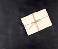 white paper cards tied with a rope on a black wooden background Royalty Free Stock Photo