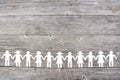 White paper children silhouette on brown wooden background