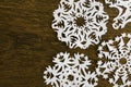 White paper christmas snowflake on a wood Royalty Free Stock Photo