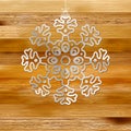 White paper christmas snowflake on a wood. + EPS8 Royalty Free Stock Photo