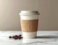 White Paper Coffee Cup on a Marble Surface with Roasted Coffee Beans Royalty Free Stock Photo