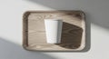 A white paper cup is centered Royalty Free Stock Photo