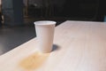 White paper cup on a table in an office center Royalty Free Stock Photo