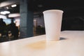 White paper cup on a table in an office center Royalty Free Stock Photo