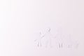 White paper cut out of family with two children and cat and copy space on white background Royalty Free Stock Photo