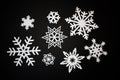 White paper cut snowflakes on black background Royalty Free Stock Photo