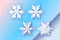 4 White Paper cut snowflakes. Four Origami Winter Decoration background. Seasonal holidays. Snowfall. Blue. Merry