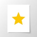 A white paper displays a large yellow five-pointed star centered Royalty Free Stock Photo