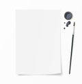 White paper document whith brush pen, inkwell and ink drops on desk. Top view mockup for hand drawn design. Royalty Free Stock Photo