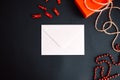 White paper envelope with gift box on black background. valentine day concept Royalty Free Stock Photo