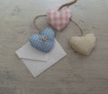 white paper envelope. hearts made of multicolored fabric