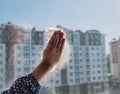 White paper in a female hand cleaning windows