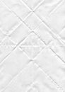 white paper flip textured white sheet of paper with realistic curled under warm incandescent Royalty Free Stock Photo