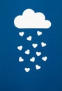 White paper hearts and clouds over the blue background. Abstract background with paper cut shapes Royalty Free Stock Photo