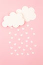 White paper hearts and clouds over pink background. Abstract background with paper cut shapes. Sainte Valentine, mother\'s day, Royalty Free Stock Photo