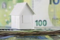 White, paper house model and Euro banknotes Royalty Free Stock Photo